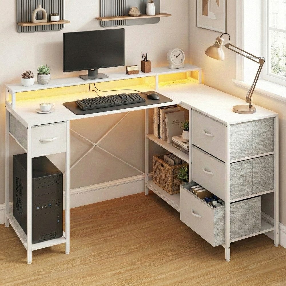 Bureau d'angle blanc ZENITH 140x100 montrant les étagères de rangement latérales et les tiroirs en tissu gris.