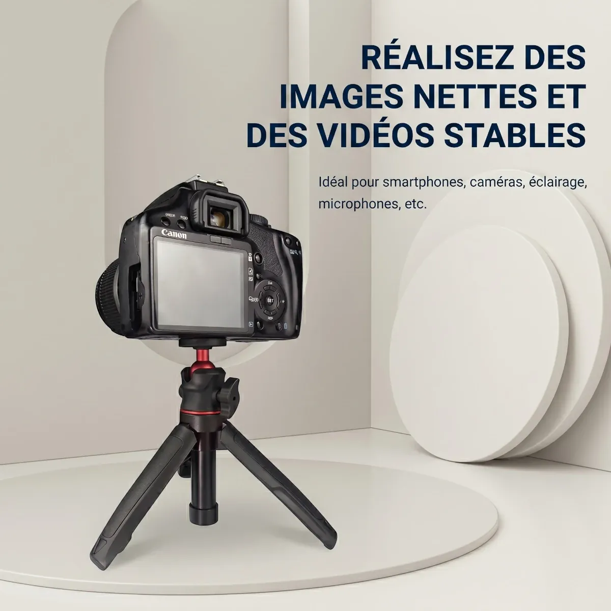 Mini trépied télescopique 3-en-1 rouge supportant une caméra reflex Canon DSLR en studio