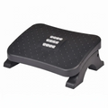 Vue de trois quarts du repose-pieds ergonomique Nexus Step en polymère haute densité sur fond blanc, montrant sa surface texturée, ses picots, et ses rouleaux de massage centraux.