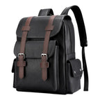 Sac à dos ordinateur femme Linéa en cuir PU noir avec sangle marron, vue studio de face sur fond blanc.