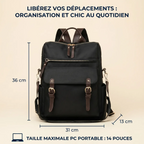 Photographie de produit d'un élégant sac à dos noir pour ordinateur femme, en nylon et cuir marron, présenté de face. Le titre au-dessus lit : 'LIBÉREZ VOS DÉPLACEMENTS : ORGANISATION ET CHIC AU QUOTIDIEN'. Les dimensions sont indiquées : Hauteur 36 cm, Largeur 31 cm, Profondeur 13 cm. En bas, une icône et le texte précisent : 'TAILLE MAXIMALE PC PORTABLE : 14 POUCES'