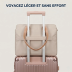 Sangle arrière de la sacoche business femme fixée sur la poignée télescopique d'une valise cabine.