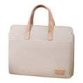 Sacoche ordinateur femme ergonomique couleur beige crème avec poignées en cuir marron clair.