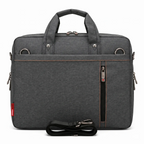 Sac ordinateur pour homme ErgoShield gris anthracite affichant le compartimentage et les finitions de protection antichoc.