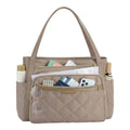 Tote bag ordinateur chic L'Ingénieuse coloris beige taupe avec compartiments organisés et finitions dorées.