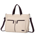 Tote bag ordinateur femme L'Aérienne 15" nylon chic ultra léger, vue de face extérieure, beige avec poignées et bandoulière marron, sur fond blanc. 