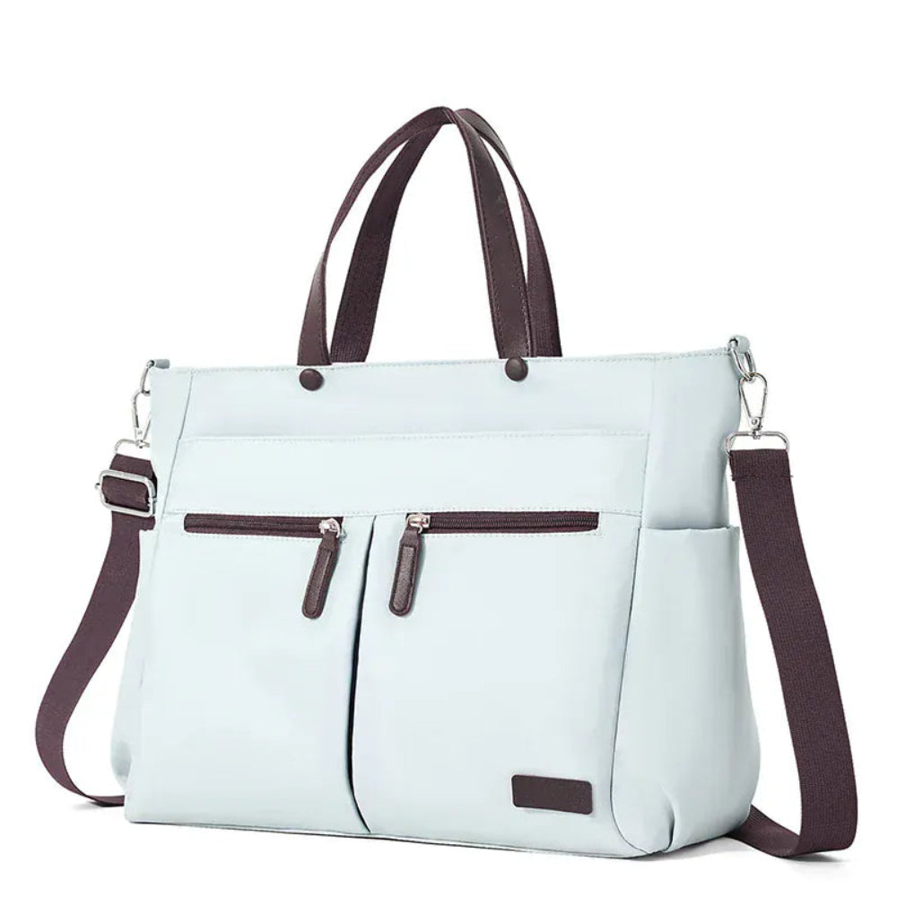 Tote bag ordinateur femme L'Aérienne 15" nylon chic ultra léger, vue de face extérieure, bleu avec poignées et bandoulière marron, sur fond blanc.