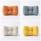 Les quatre variantes de couleurs du Coussin Lombaire Ergonomique Cocon Morpho : une solution design de soutien et posture.
